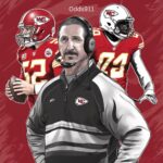 Steve Spagnuolo standing on the sidelines in Kansas City Chiefs gear, reviewing play calls.